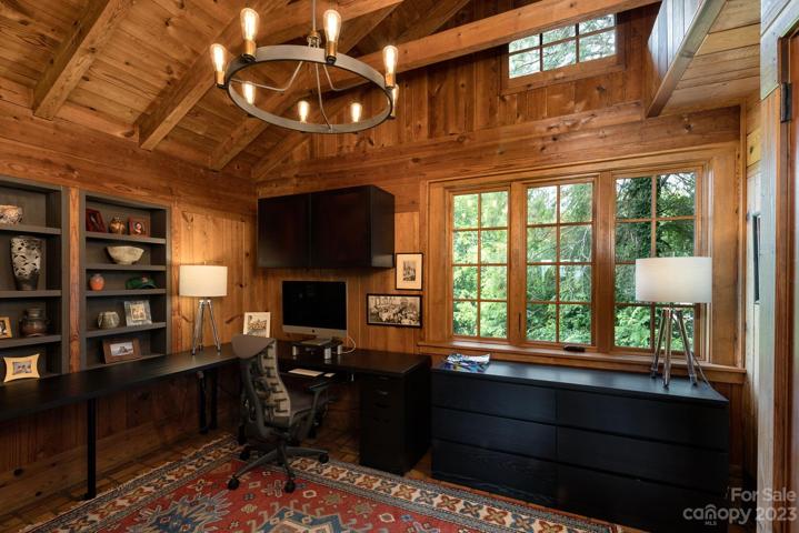 Office with beautiful natural beamwork creates height and charm
