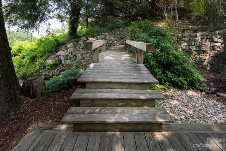 Bridge between waterfall and koi pond