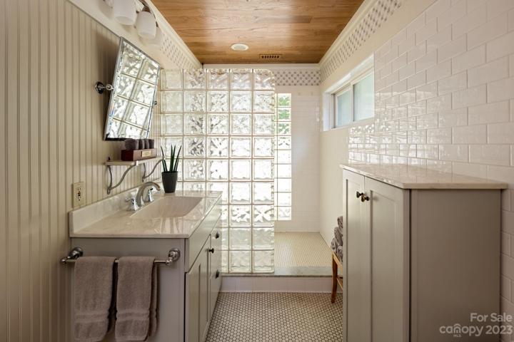 Cottage bathroom with glass block shower