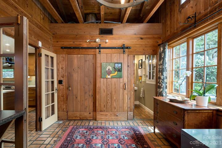 Office - enjoy custom built-ins and exposed beam accents