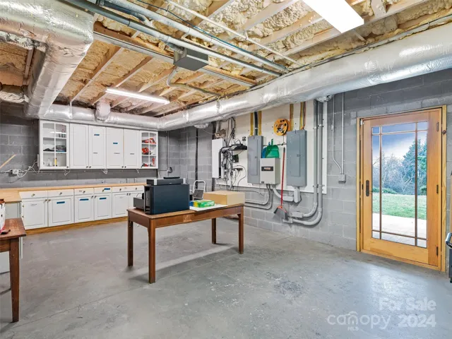 ...a workshop/hobby/craft space - with access to both daylight as well as access to the outside. Additionally, this home offers so many more amenities such as: a CPI security system, Nest thermostat, four (4) HVAC systems - 2 are brand new and 2 are 11 years young, a commercial grade internet and a Generac...