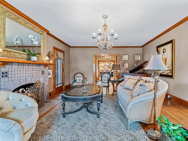 Feel the warmth of that gas fireplace. Hear the notes on the piano. Journey through the historic door on the left...