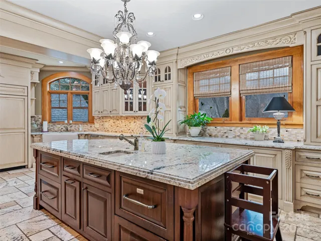 ...a crystal chandelier, an oversized island, a separate prep sink, an abundance of storage...