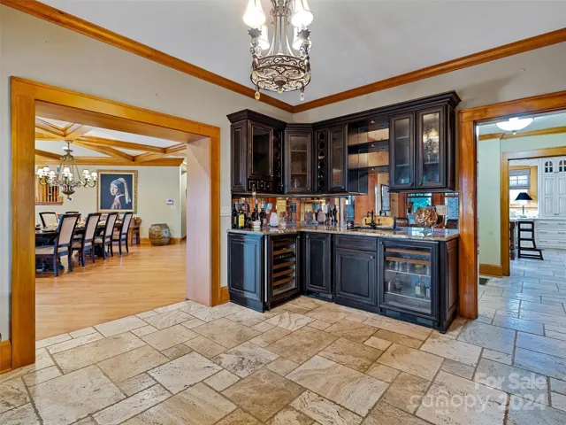 ...an entire Bar Room with built-ins, two (2) refrigerators, an icemaker and various bar accoutrements