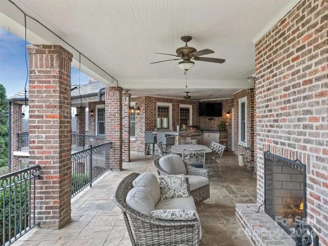 ...to al fresco living cozied around the wood burning fireplace (with a gas starter) and gathering around the outdoor table while entertaining