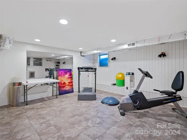 The Lower Level offers more than 3,000+ square feet of: a 2nd living quarters (601 sq. ft.) with a private entrance, an exercise venue, a plethora of storage rooms/areas, another bathroom shower, a three sink system for floral bouquets and so much more...such as...