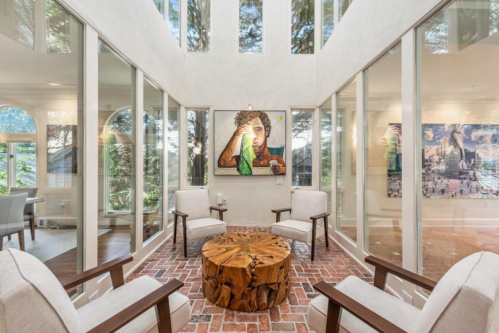 Two story light filled atrium between the foyer and dining room.