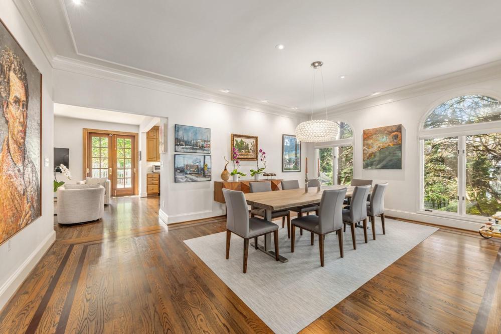 Large dining room with inlaid wood floors.