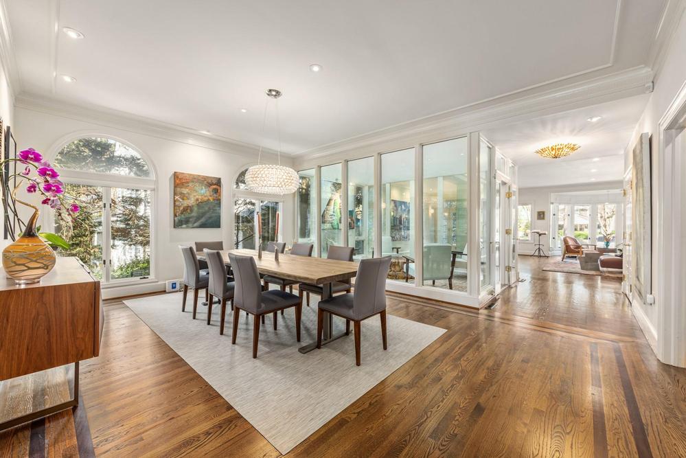 Dining room has an open feeling with outside views and views into the atrium.
