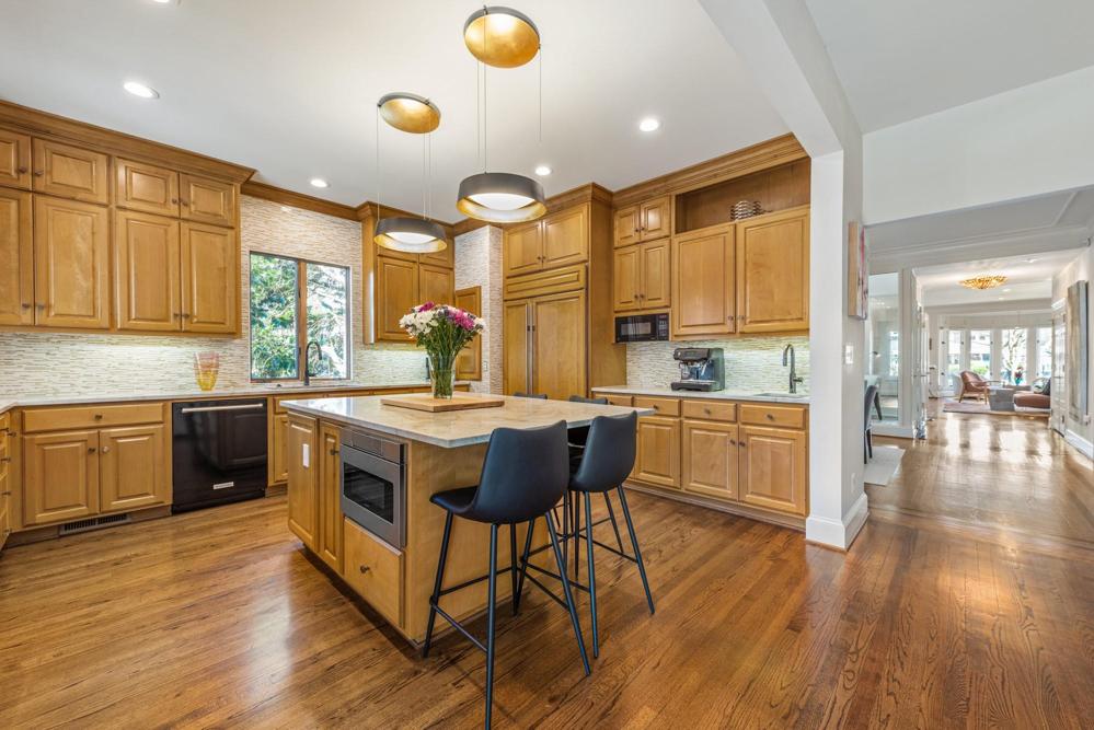 Kitchen is conveniently located next to the dining room and sitting area.
