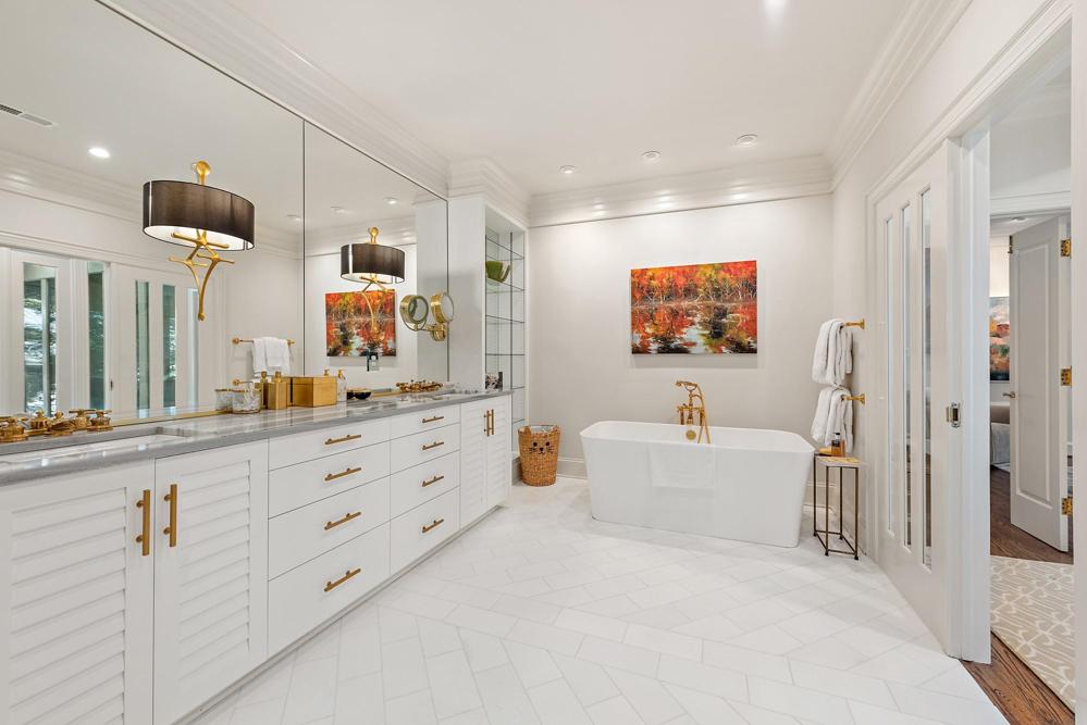 Updated primary bath with gorgeous tub and  plenty of counterspace!