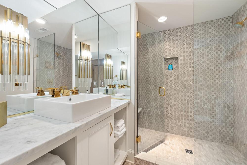 Updated bath with large shower on the lower level