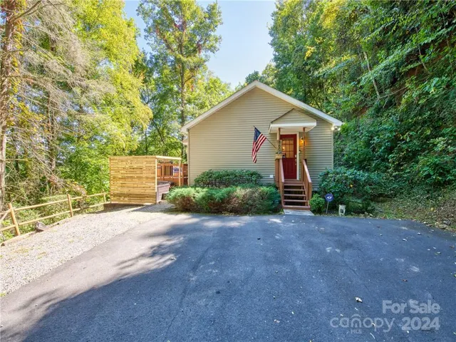 View of parking area and entrance in to kitchen