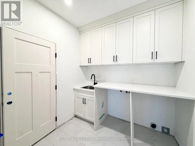 Main Floor Laundry off the 2 Car Garage
