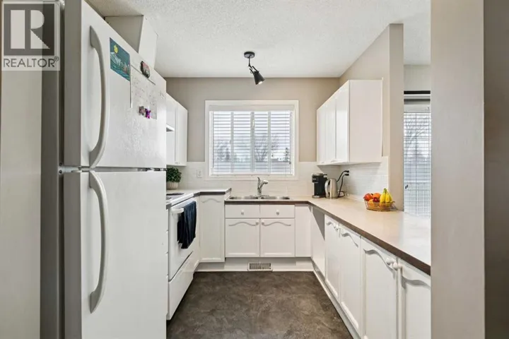 104, 7 Harvest Gold Manor NE, Calgary, Alberta T3K4Y3