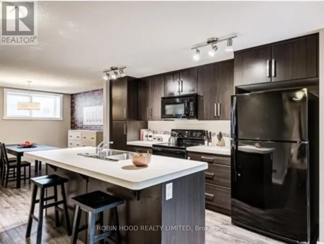 100 - 517 MCKENZIE TOWNE CLOSE S, Calgary, Alberta T2Z1A8