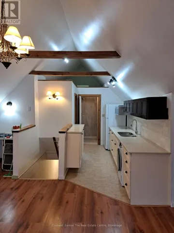 Kitchen leads into bathroom and bedroom