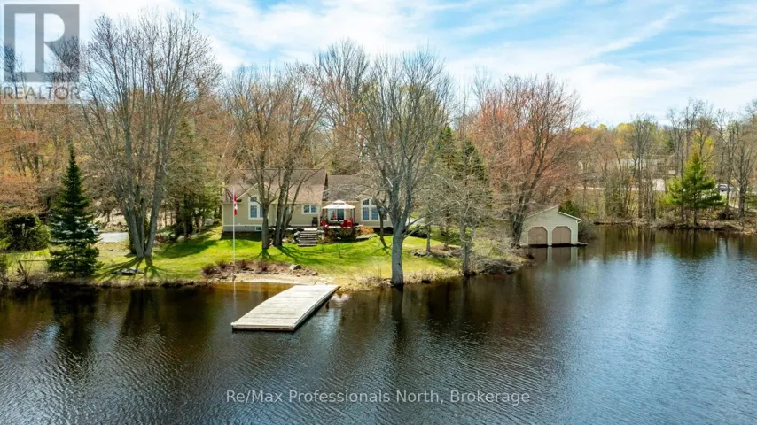 Cottage, dock, beach and double boathouse
