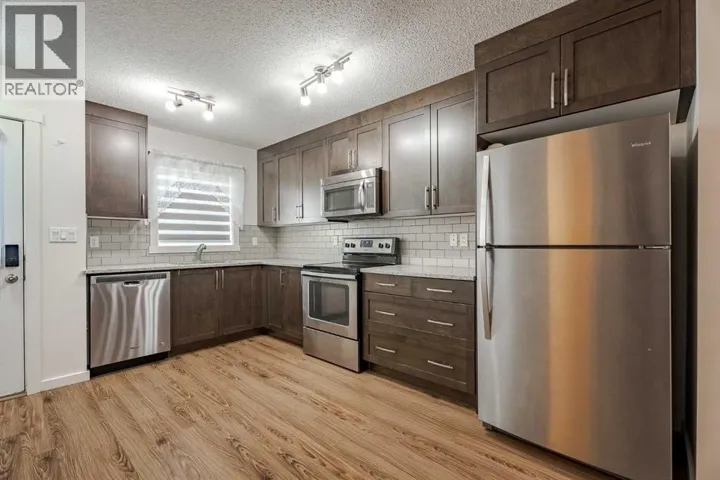 202, 2400 Ravenswood View SE, Airdrie, Alberta T4A0v7