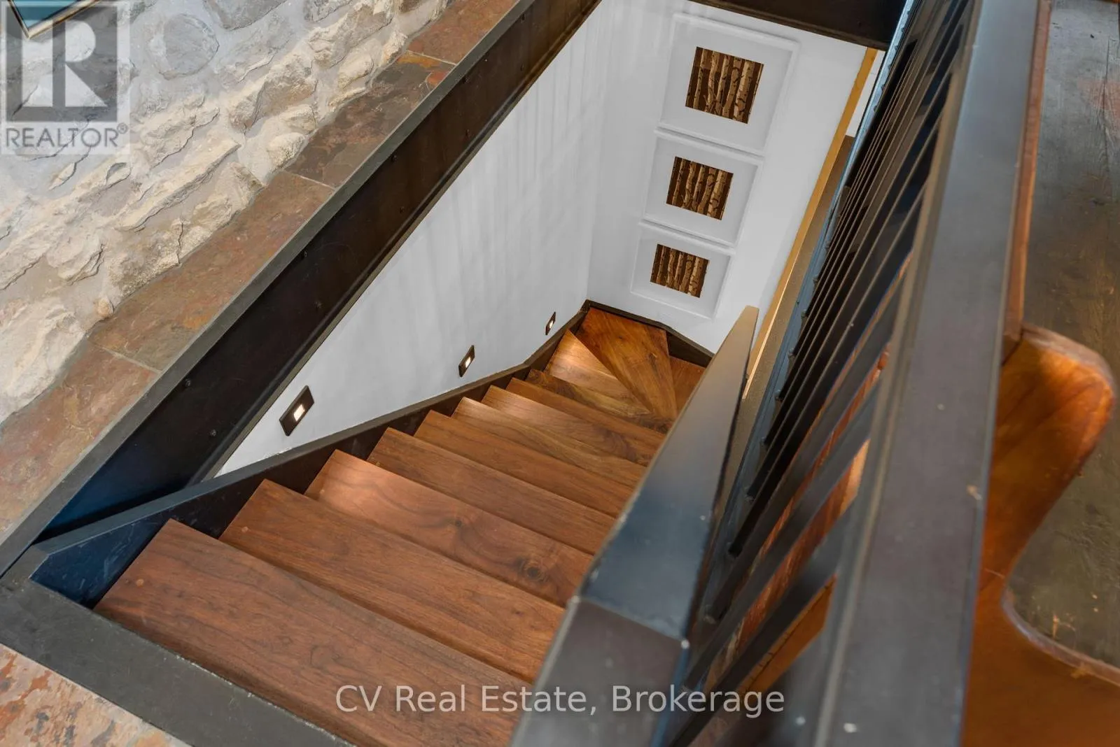 Walnut staircase leads to finished lower level Walnut staircase leads to finished lower level