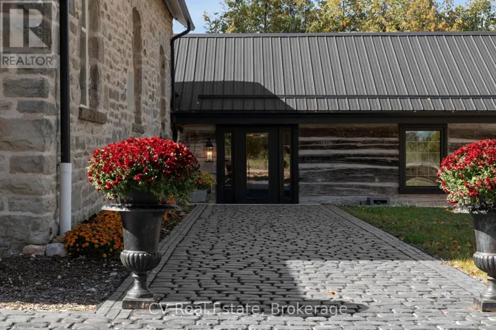 Cobblestone pathway leads to the front entrance