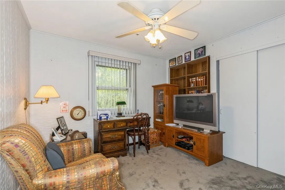 Third bedroom with hardwood below the carpeting Third bedroom with hardwood below the carpeting