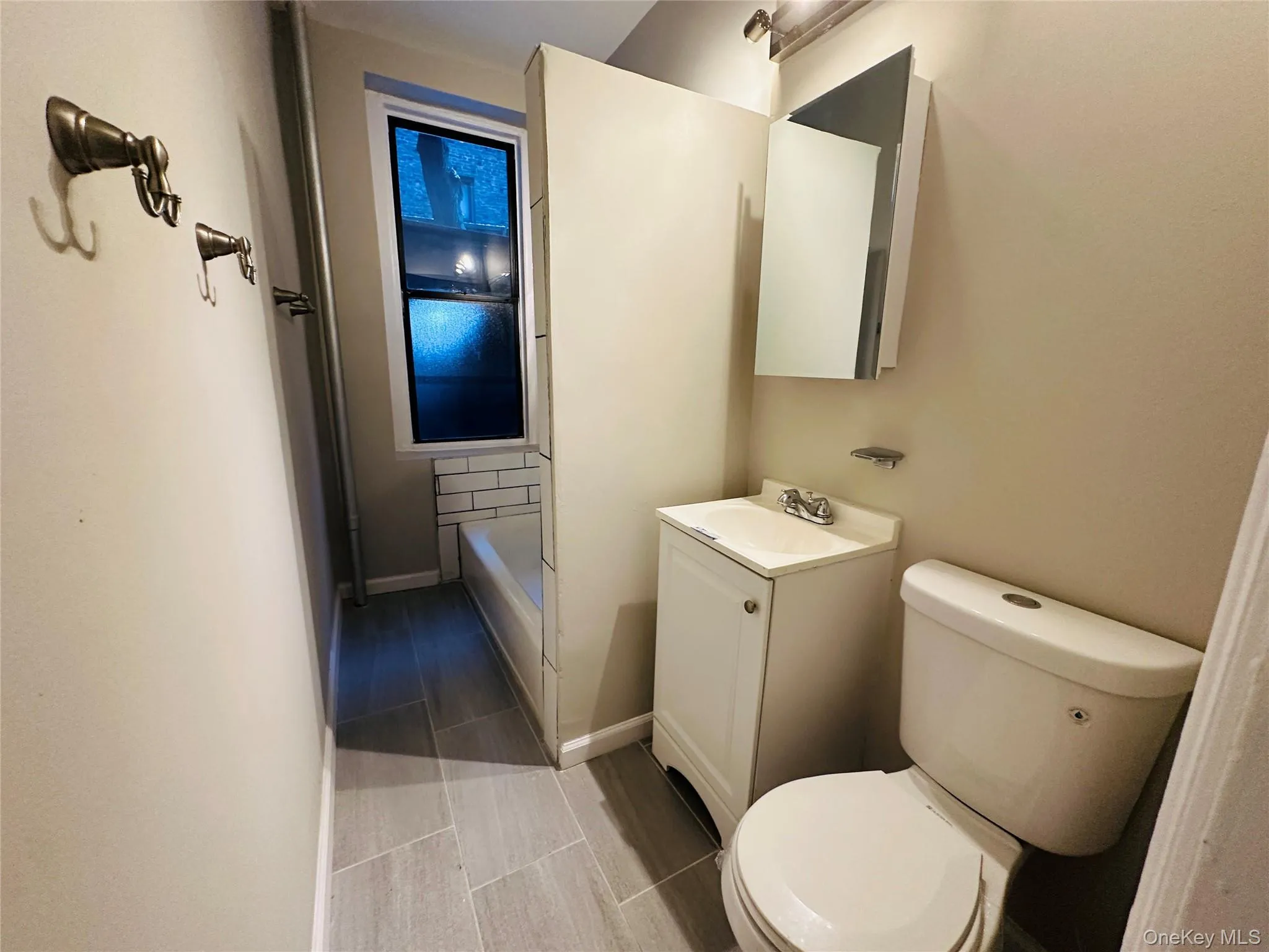 Bathroom featuring vanity and toilet Bathroom featuring vanity and toilet