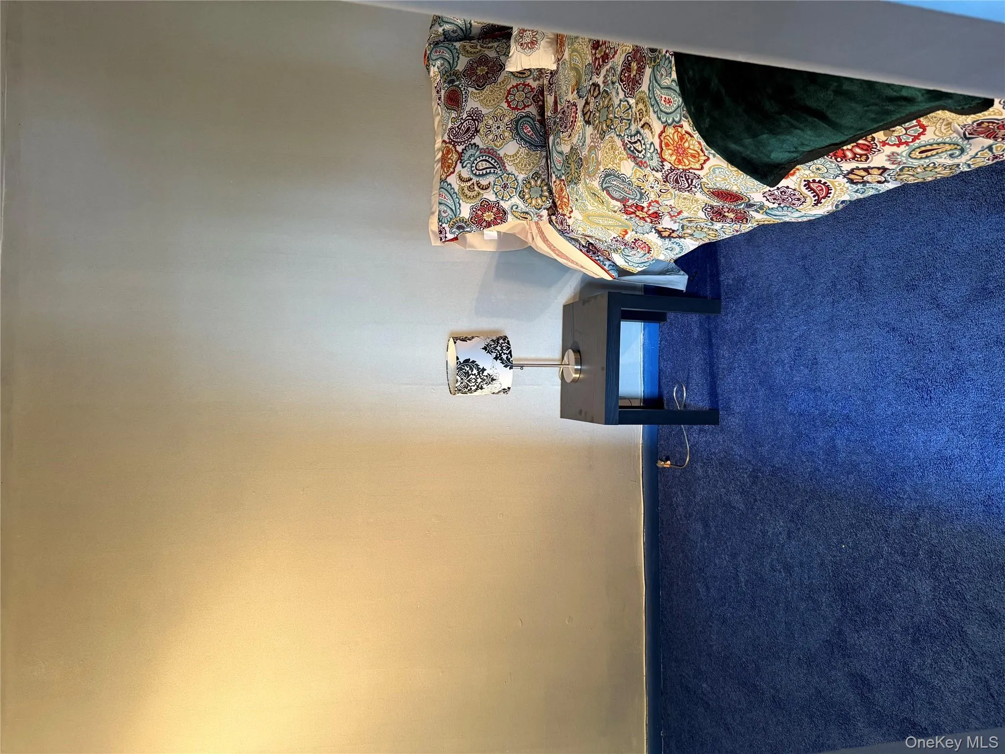 Carpeted bedroom with baseboards Carpeted bedroom with baseboards