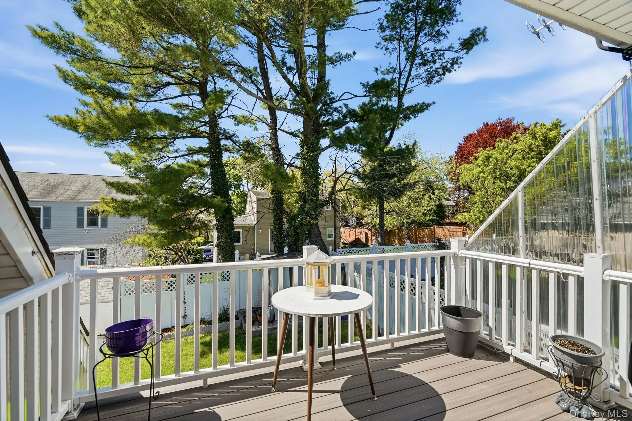 Private deck overlooking the level yard. Private deck overlooking the level yard.