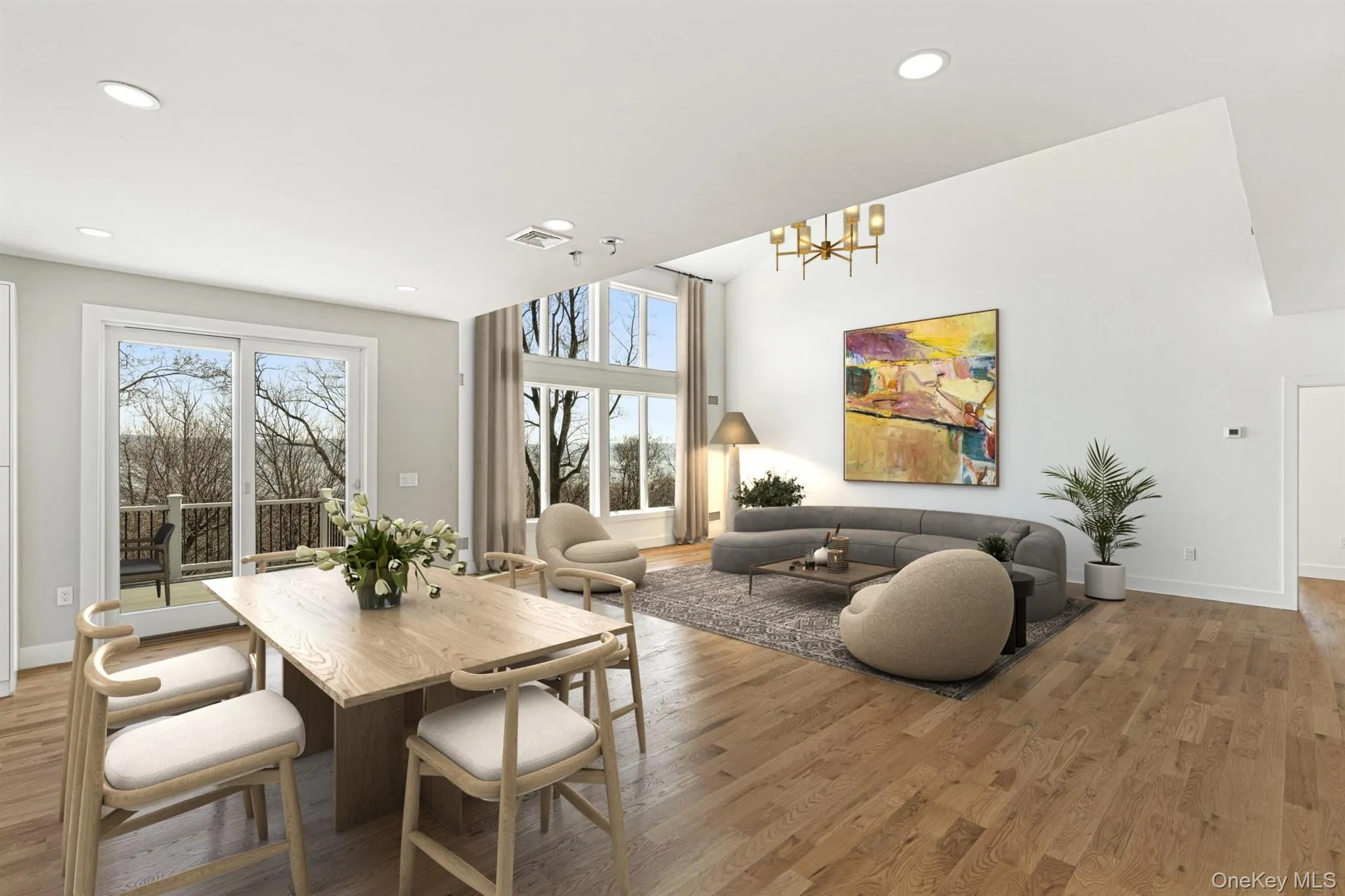 Breakfast Room open to the Chef's Kitchen and Great Room with deck access virtually staged Breakfast Room open to the Chef's Kitchen and Great Room with deck access virtually staged
