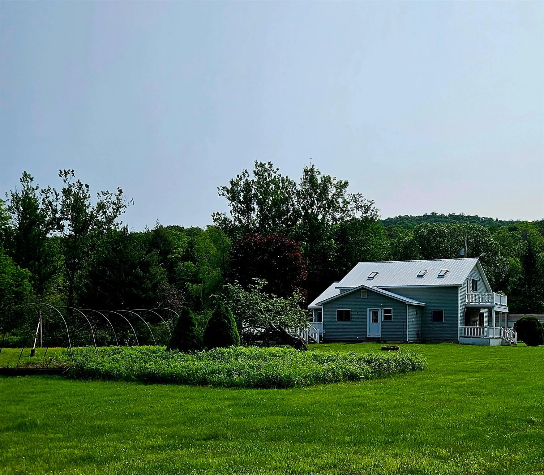View of grassy yard featuring a forest view View of grassy yard featuring a forest view
