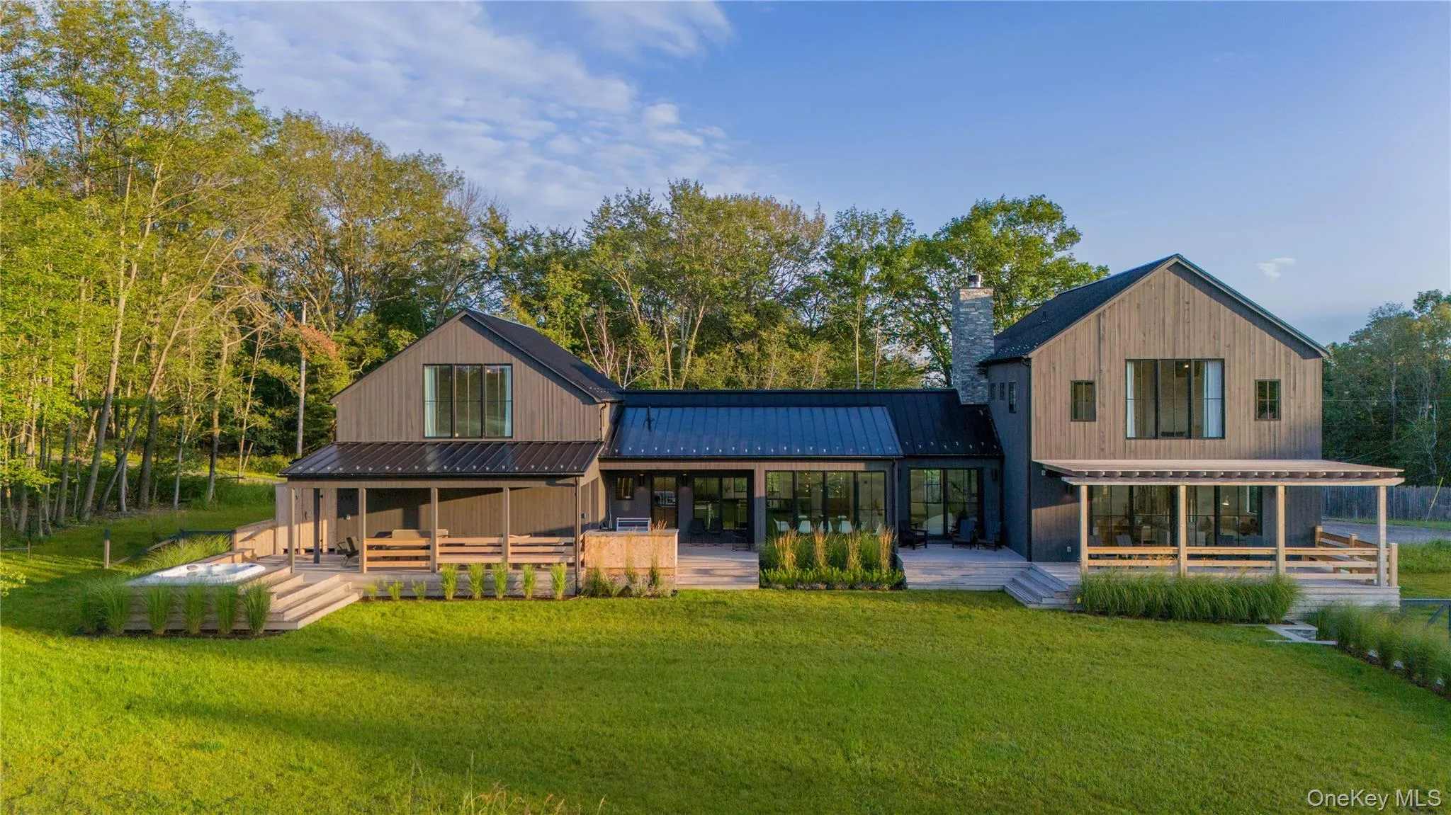 Back of house with patio/porch areas and a yard Back of house with patio/porch areas and a yard