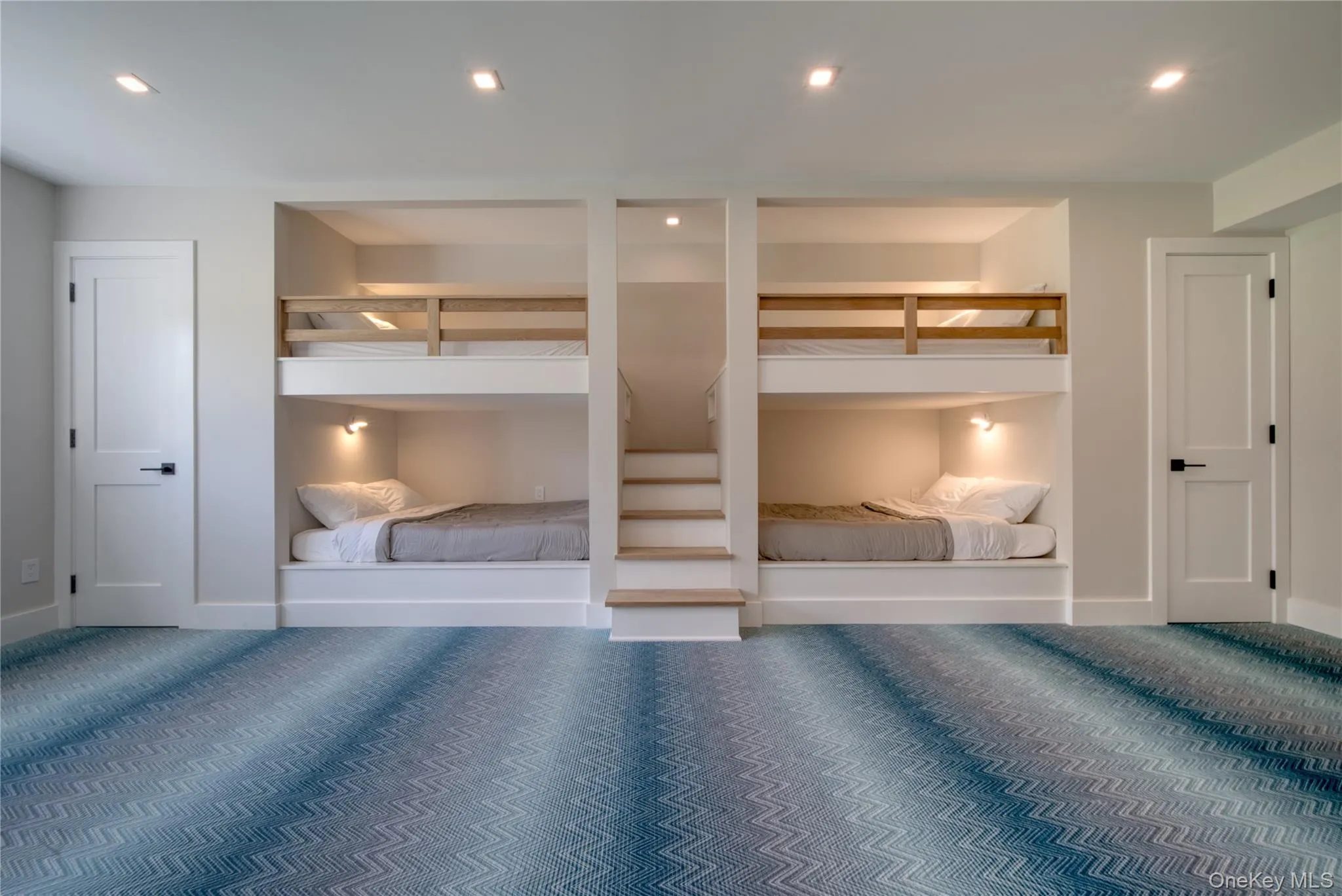 Stylish bunkroom featuring designer carpet floors Stylish bunkroom featuring designer carpet floors