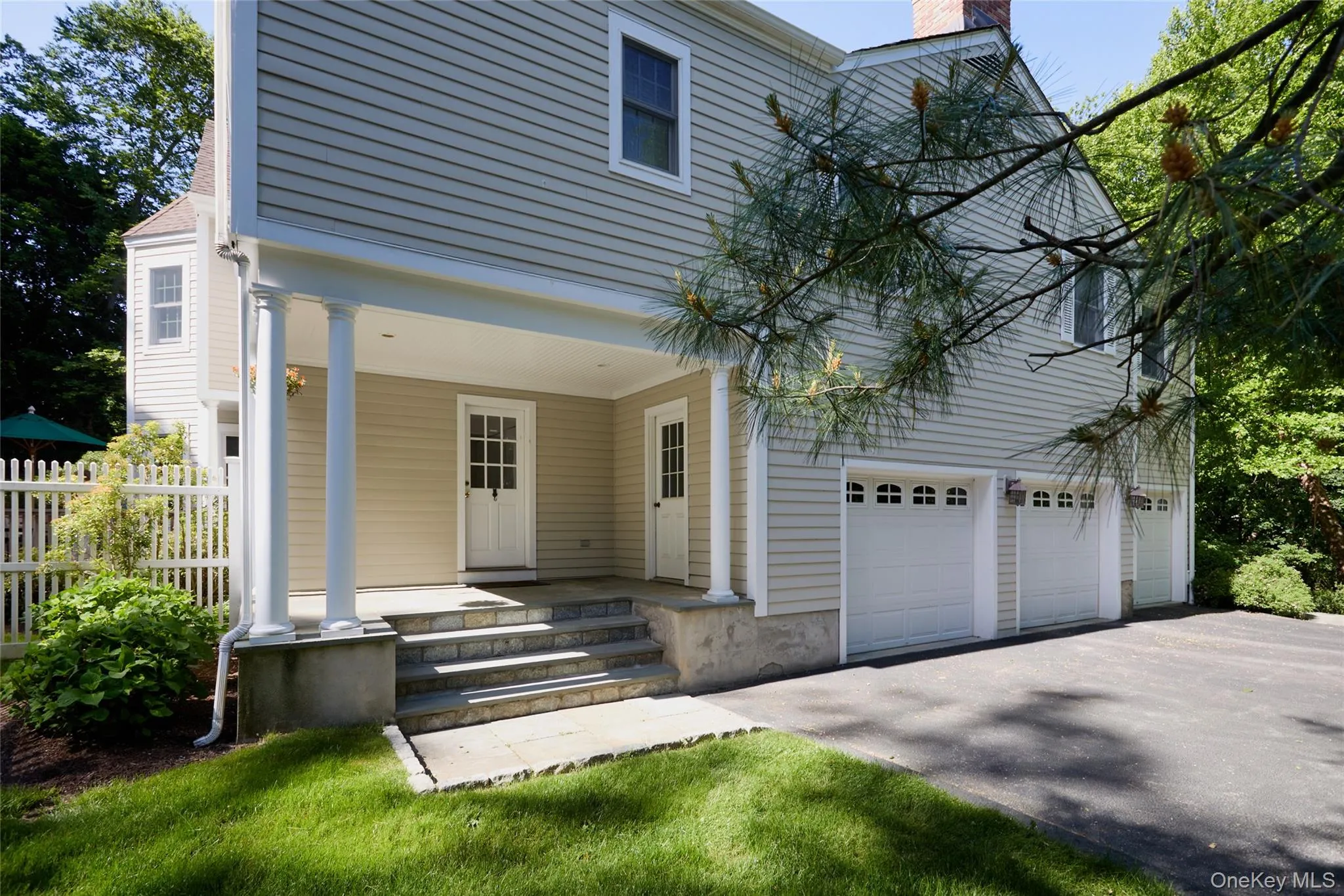 Charming porch & 3 car garage Charming porch & 3 car garage