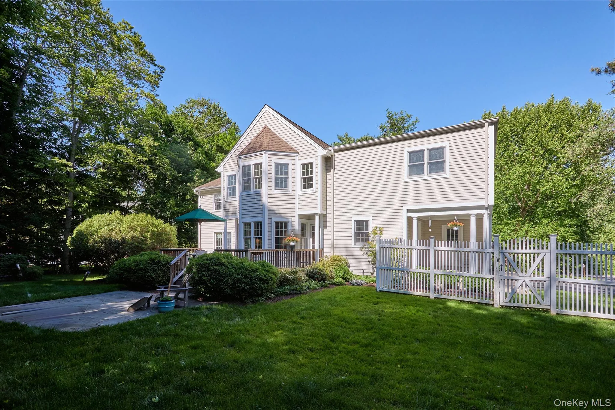 Completely fenced in beautiful yard with patio and gardening beds Completely fenced in beautiful yard with patio and gardening beds
