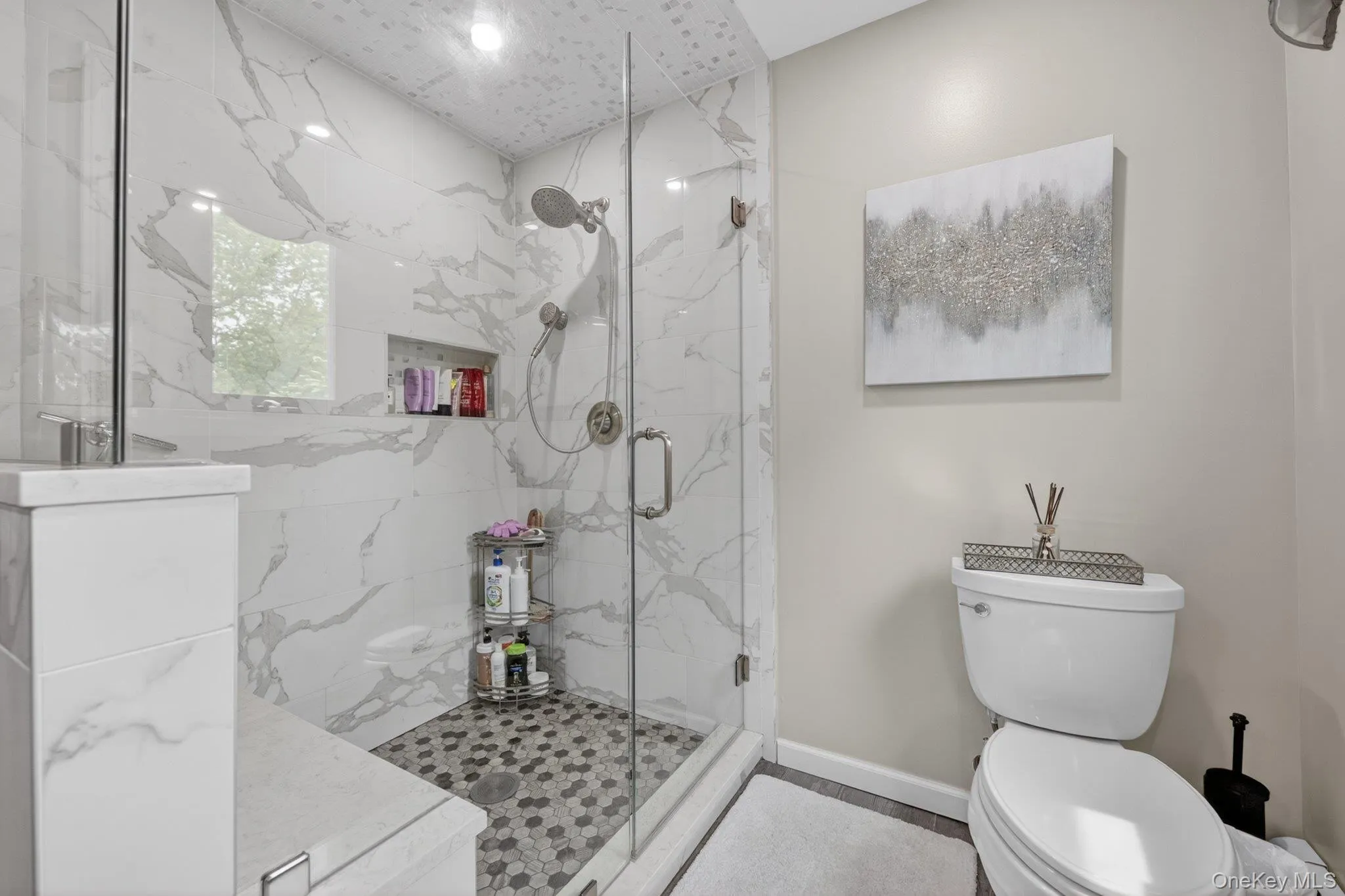 Oversized glass enclosed shower with seating. Oversized glass enclosed shower with seating.