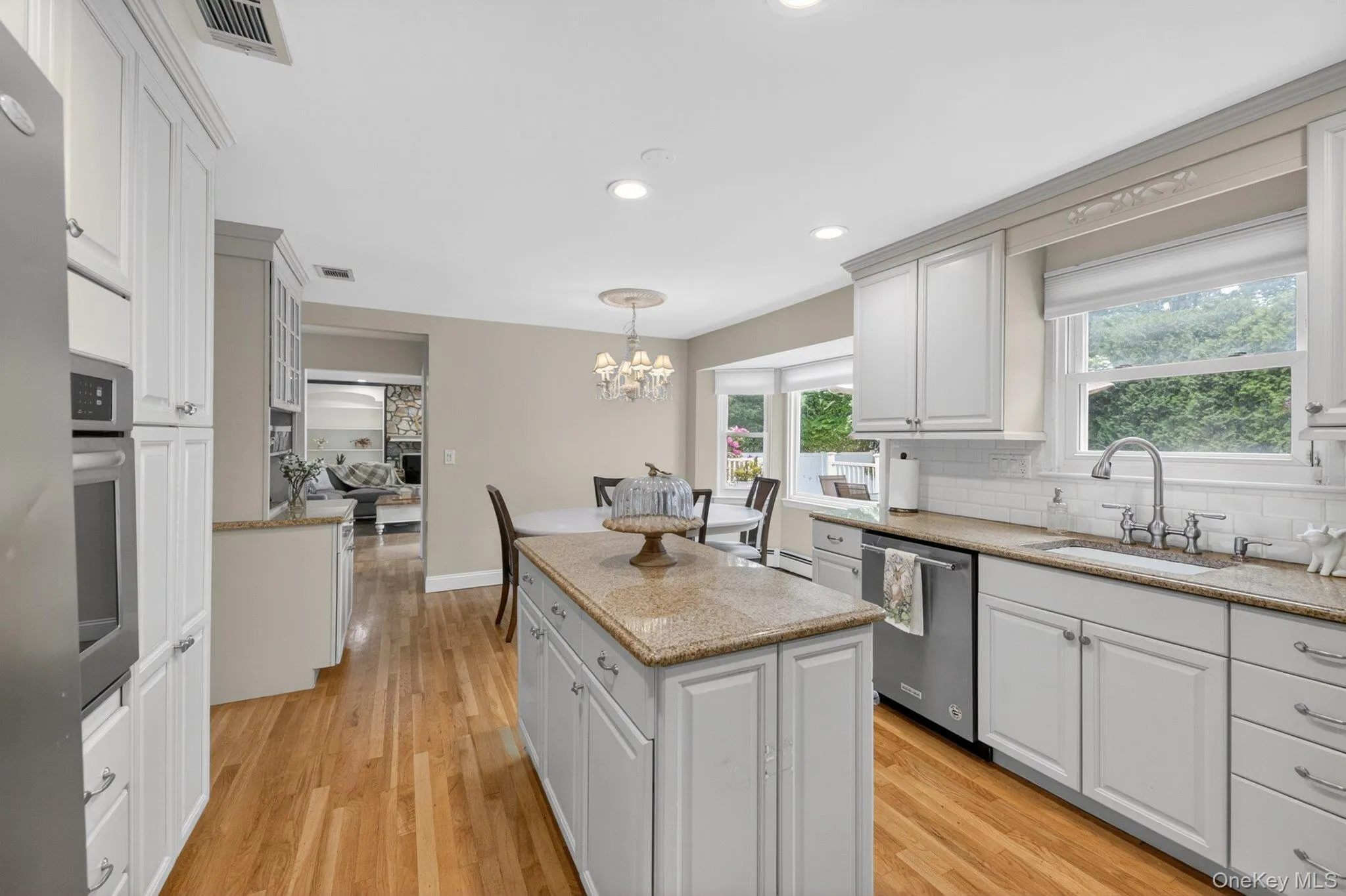 Abundance of cabinetry, granite counters and a center island for meal prep is ideal. Abundance of cabinetry, granite counters and a center island for meal prep is ideal.