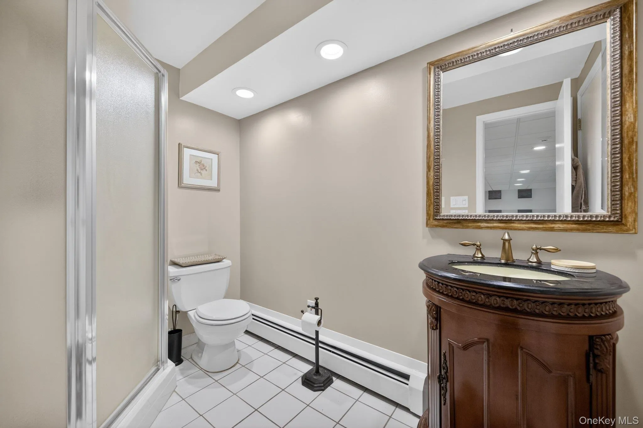 Full bath with shower in lower level. Full bath with shower in lower level.