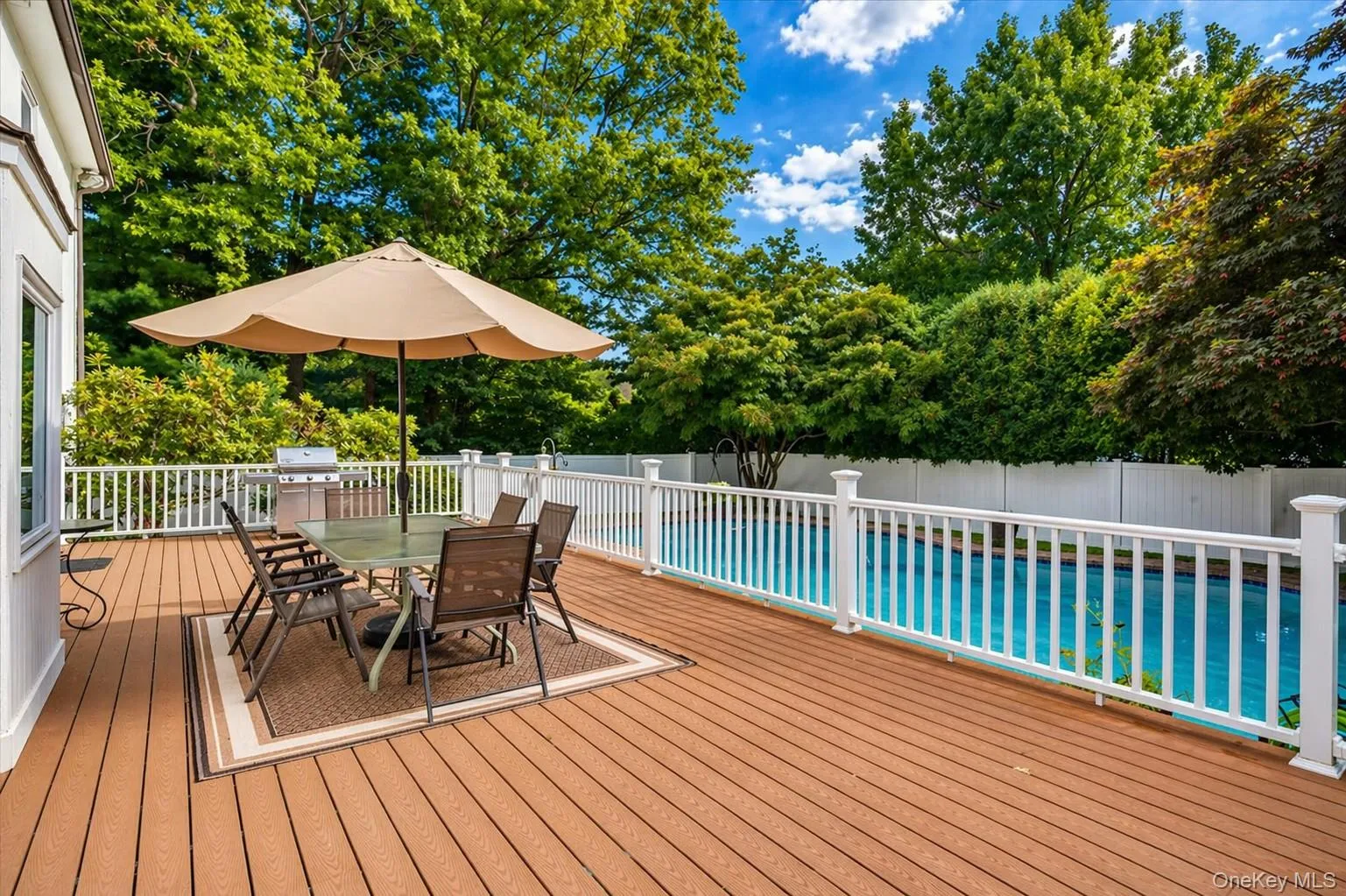 Extensive Trex deck to grill, relax, and soak in the sun poolside. Extensive Trex deck to grill, relax, and soak in the sun poolside.