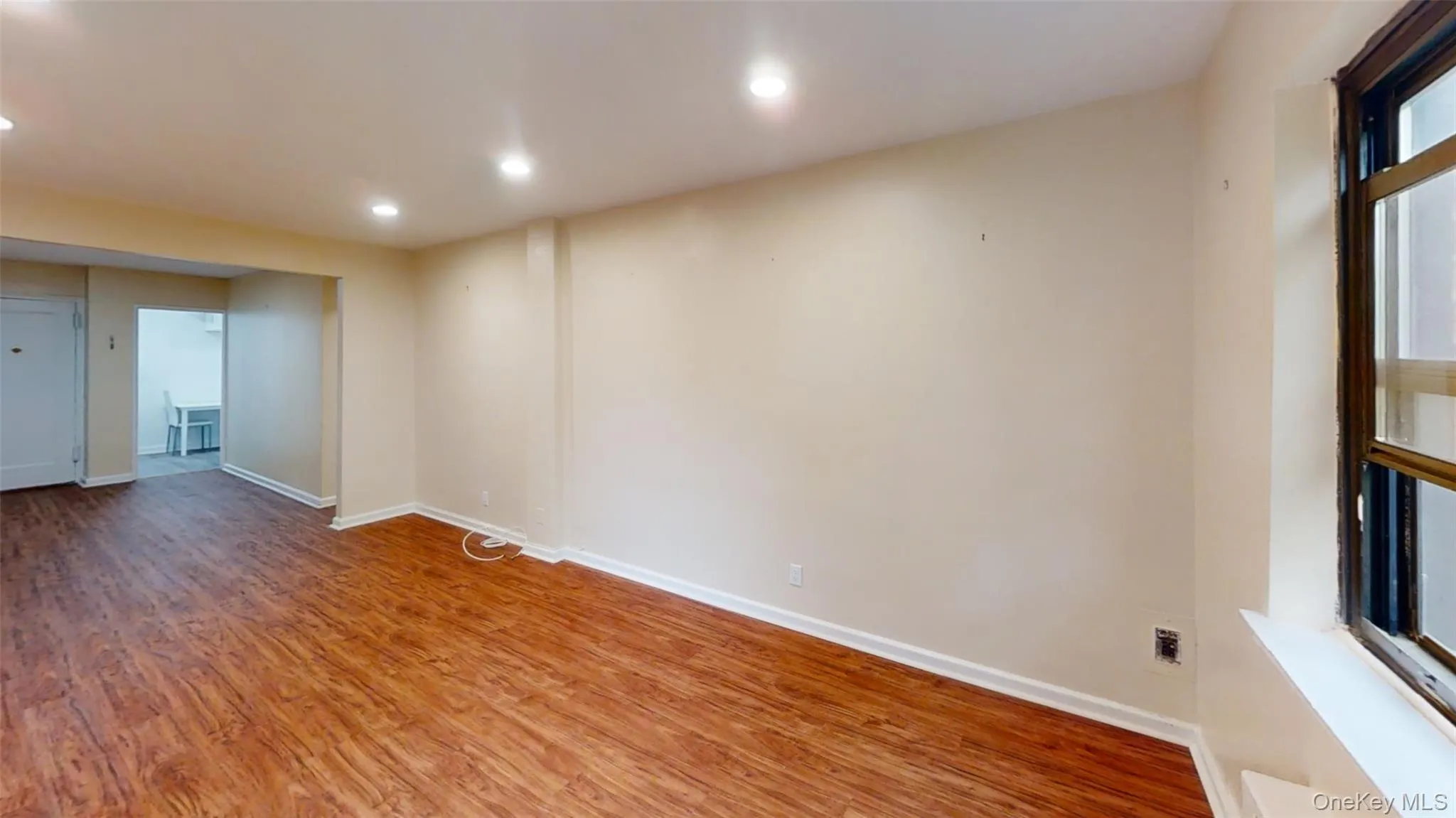 Empty room featuring light wood-style floors, recessed lighting, and baseboards Empty room featuring light wood-style floors, recessed lighting, and baseboards