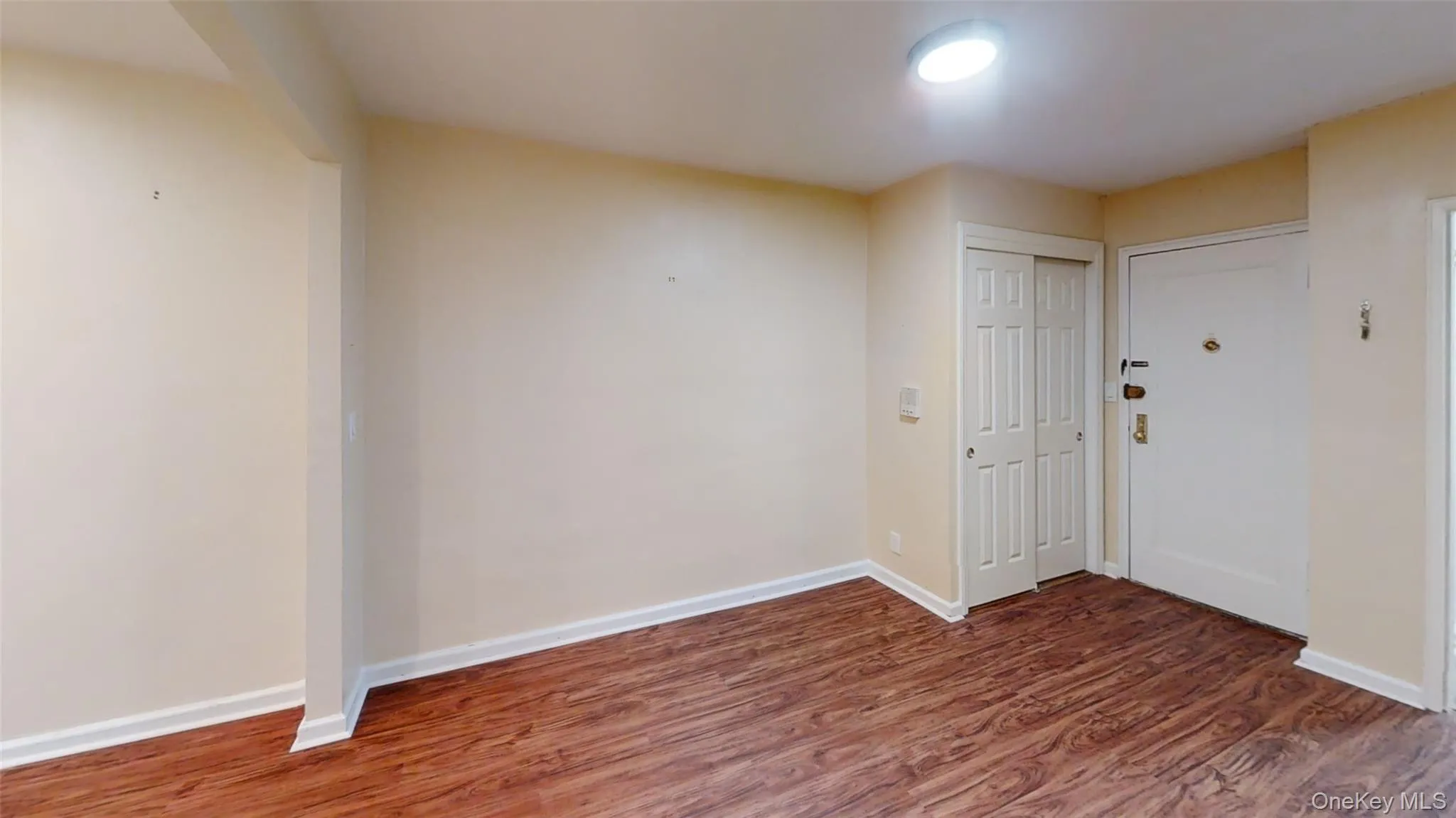 Foyer featuring wood finished floors and baseboards Foyer featuring wood finished floors and baseboards