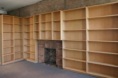Walls of wood shelving w/non-working fpl accent Walls of wood shelving w/non-working fpl accent