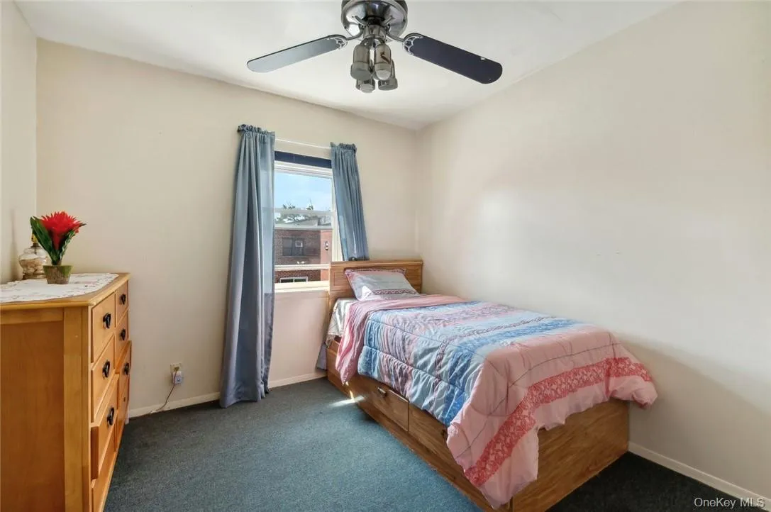 Carpeted bedroom with ceiling fan Carpeted bedroom with ceiling fan