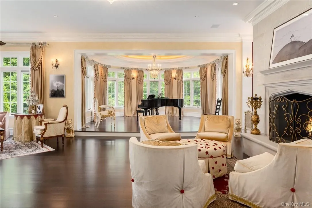Living room, ventian plaster, hardwood flooring, and crown molding Living room, ventian plaster, hardwood flooring, and crown molding