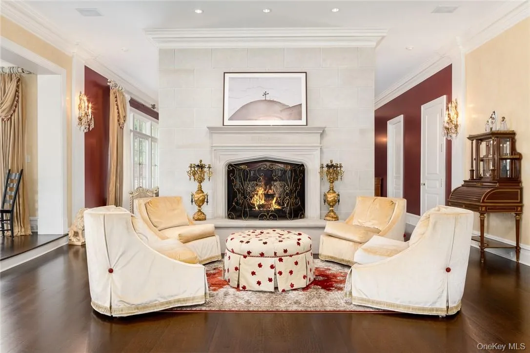 Living room with ornamental molding and dark hardwood / wood-style flooring Living room with ornamental molding and dark hardwood / wood-style flooring