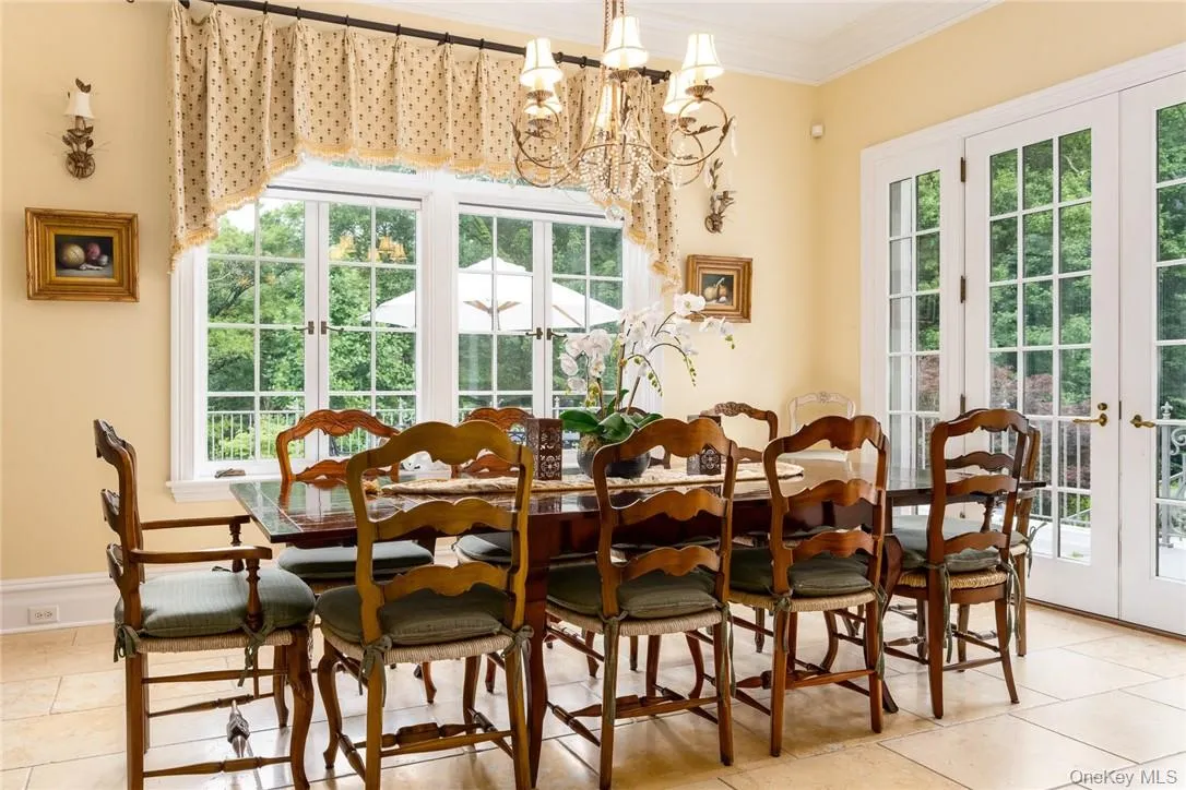Informal Dining area with French Doors to Terrace overlooking pool. Informal Dining area with French Doors to Terrace overlooking pool.