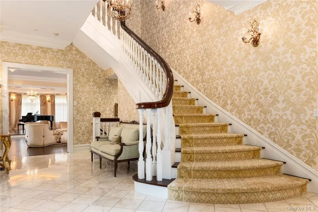 Entry Foyer. Marble floors, ornamental molding, sweeping staircase Entry Foyer. Marble floors, ornamental molding, sweeping staircase