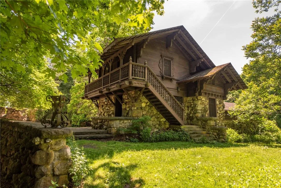 View of property exterior featuring a lawn View of property exterior featuring a lawn