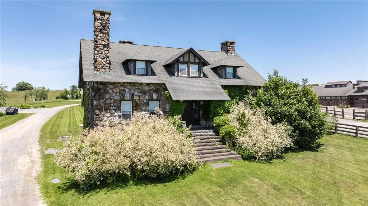 Tudor-style house with a front yard Tudor-style house with a front yard