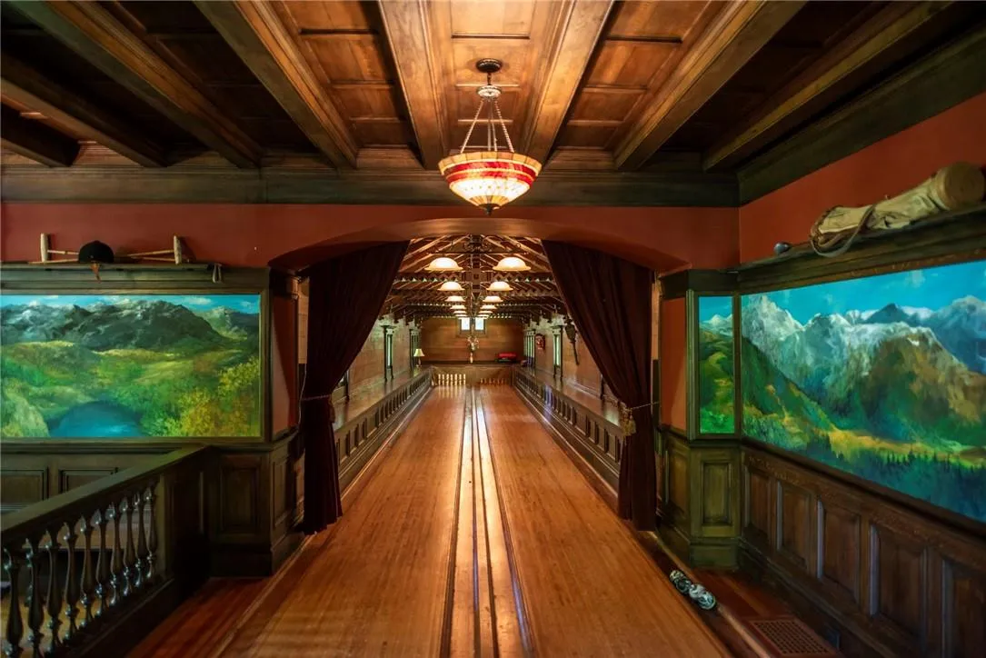 Rec room with beam ceiling, an inviting chandelier, wood ceiling, and wood-type flooring Rec room with beam ceiling, an inviting chandelier, wood ceiling, and wood-type flooring